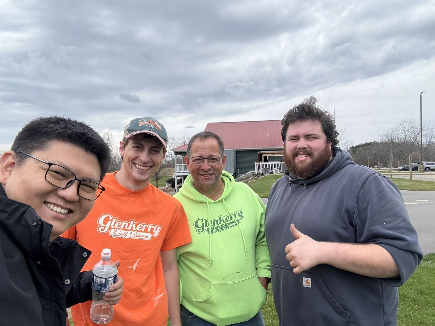 Group photographed during a golf cart business visit