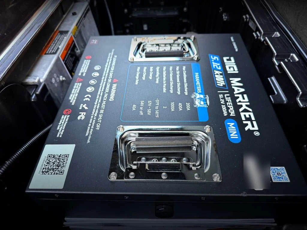Close view of a DigiMarker lithium battery installed inside a golf cart battery compartment
